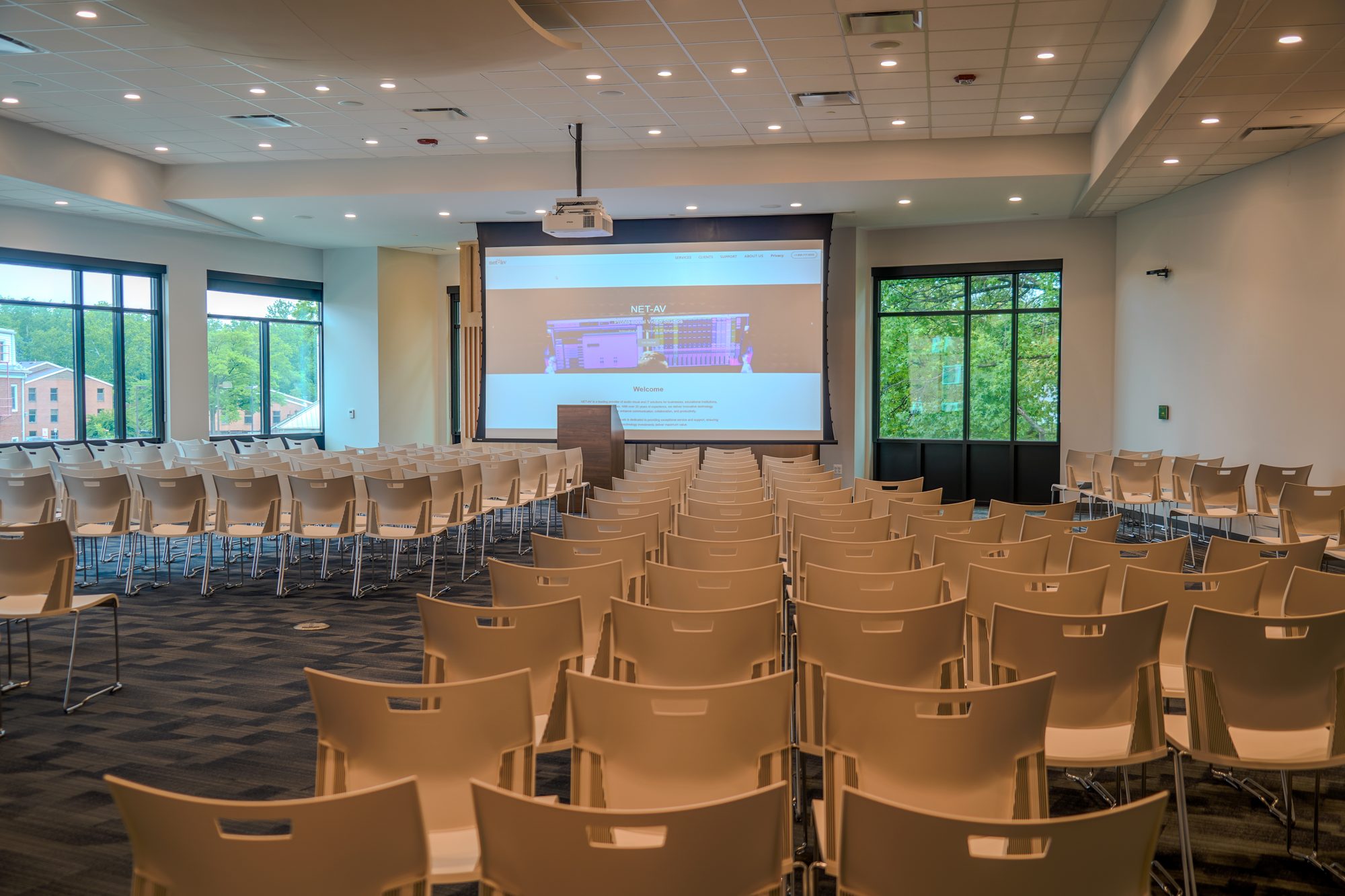 Multipurpose assembly room with motorized projection screen, a university student center